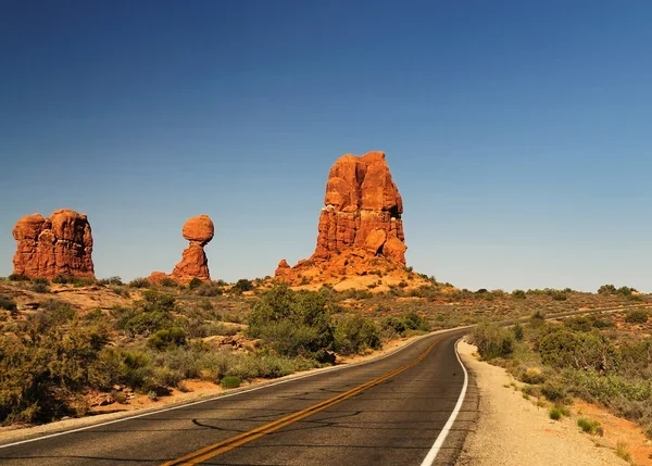 Road through red rock formations