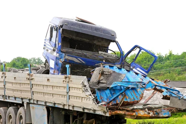 Wrecked truck cab on a flatbed