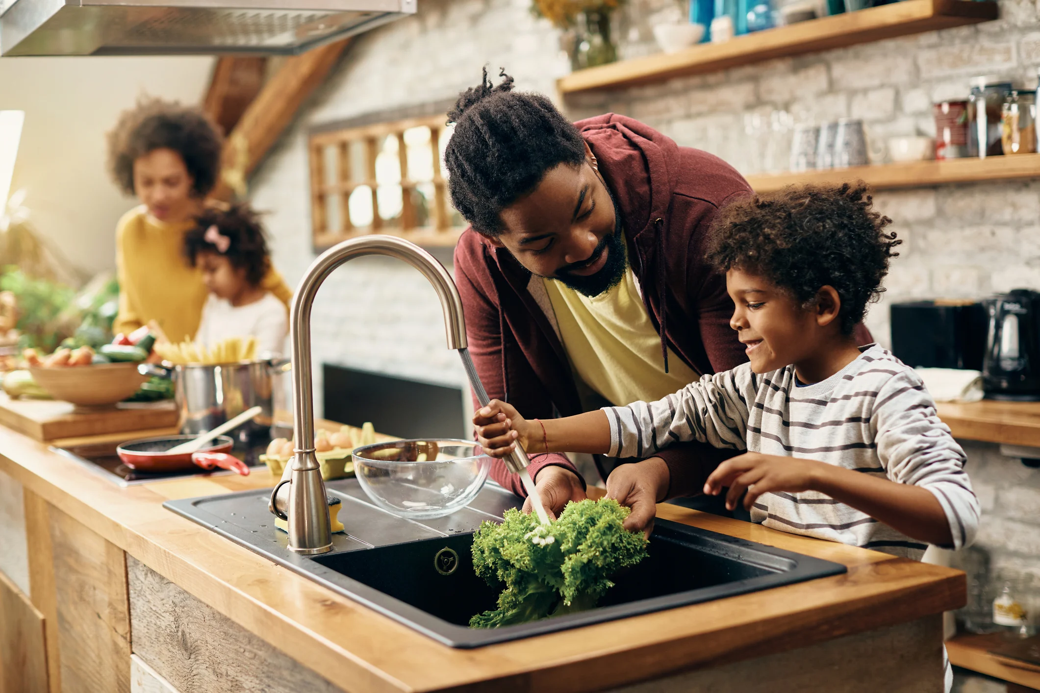 Family preparing a meal together in a kitchen