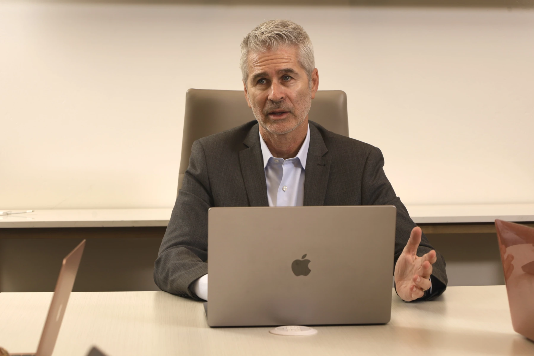 Ron Kramer discussing a matter at the office