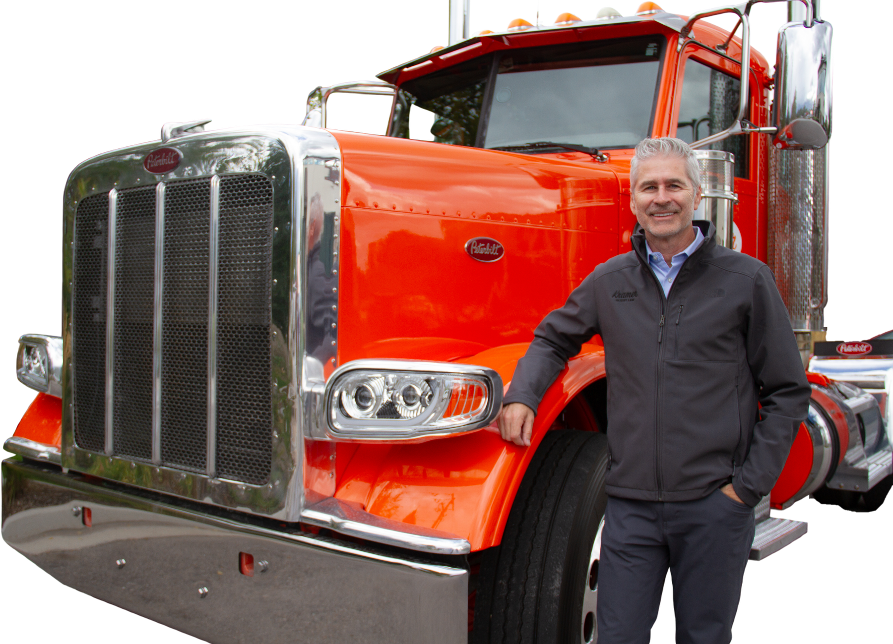 Ron Kramer beside his red Peterbilt truck